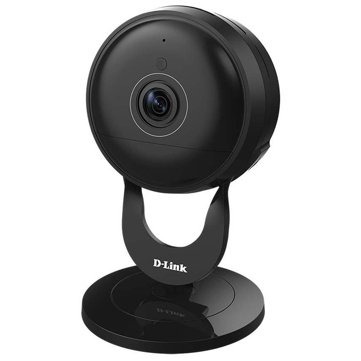 A black circular webcam stands upright on a circular base, featuring a lens in the center, positioned for capturing video in a room.