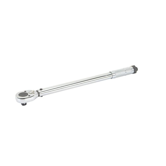 A shiny, metallic torque wrench lies horizontally, designed for tightening bolts with precise force in a mechanical or automotive setting.