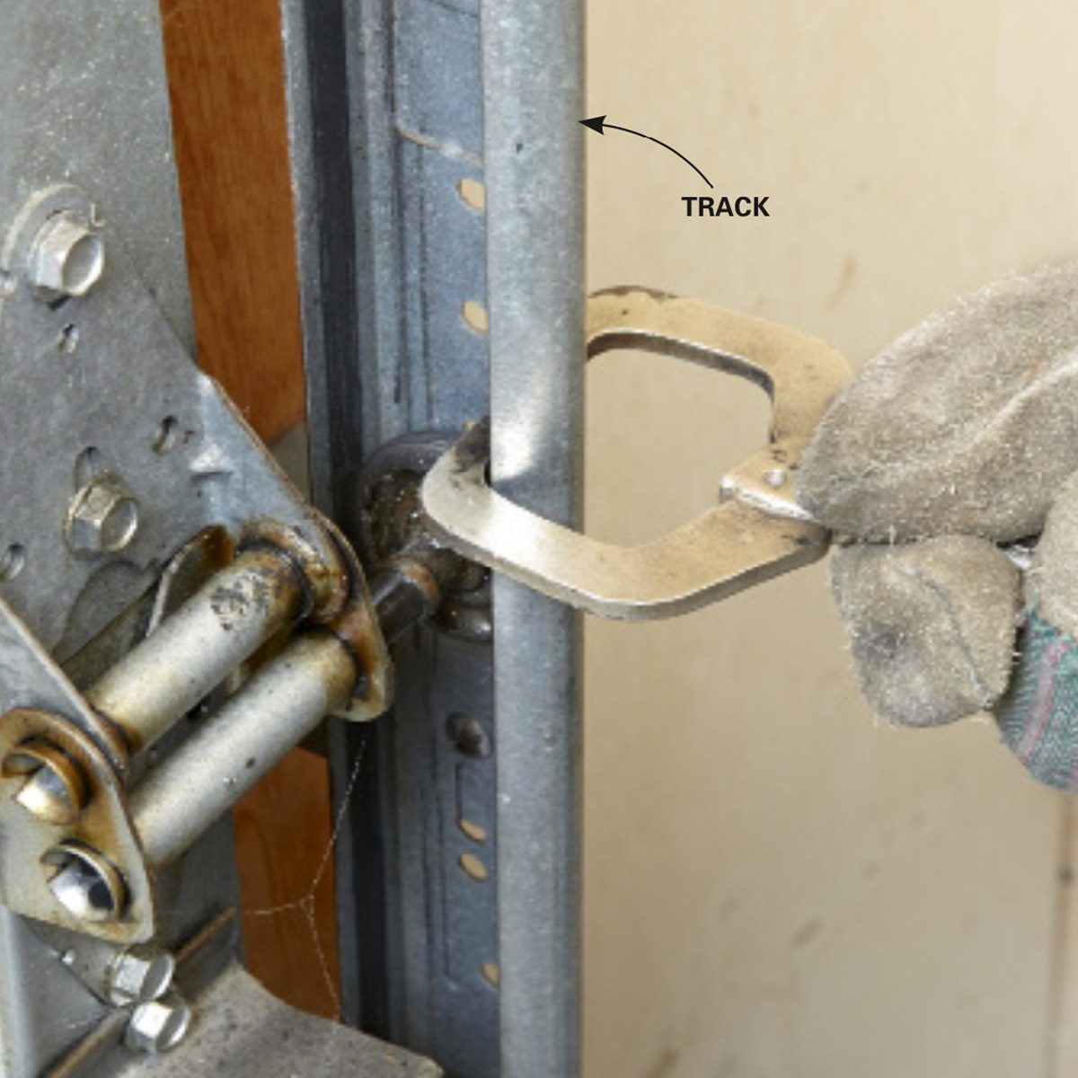 Clamp garage door to the track