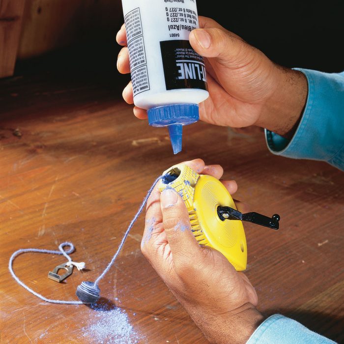Loading blue chalk into a chalkline | Construction Pro Tips