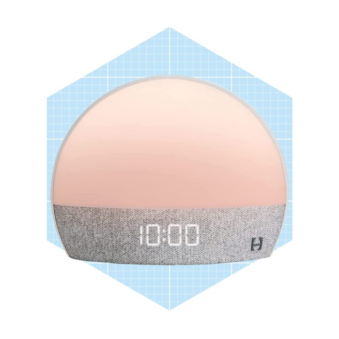 A rounded alarm clock displays the time 