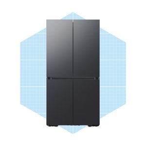 A black refrigerator stands upright, featuring four doors, against a blue grid-patterned background. It is designed for storing food and beverages.