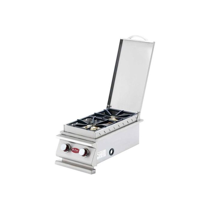 A stainless steel gas stove with an open lid and four burners sits on a flat surface, ready for cooking in a kitchen environment.