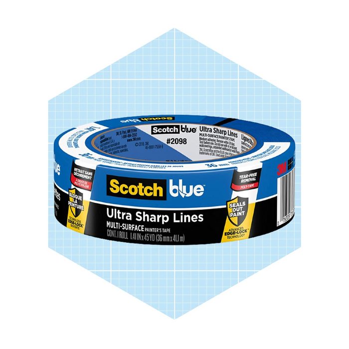 A roll of blue painter's tape is positioned upright, designed for sharp lines in painting. It stands on a light blue grid background.
