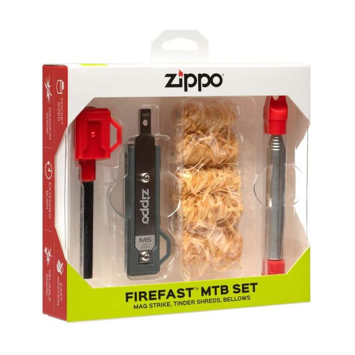 A fire-starting kit contains a magnesium striker, tinder shreds, and a bellows, all packaged in a clear box labeled 