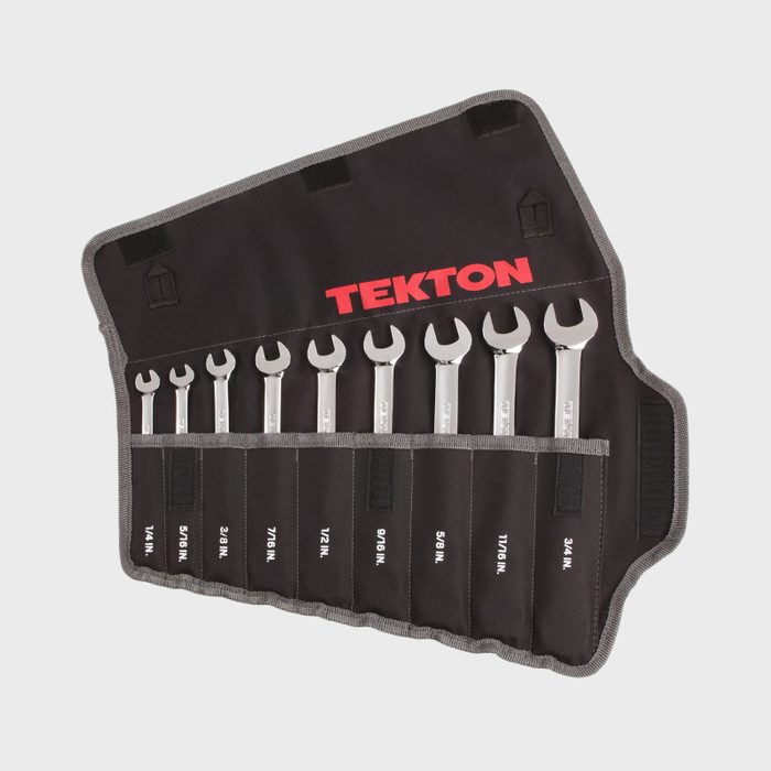 A tool roll displays several shiny wrenches, organized by size and secured in fabric pockets, with 