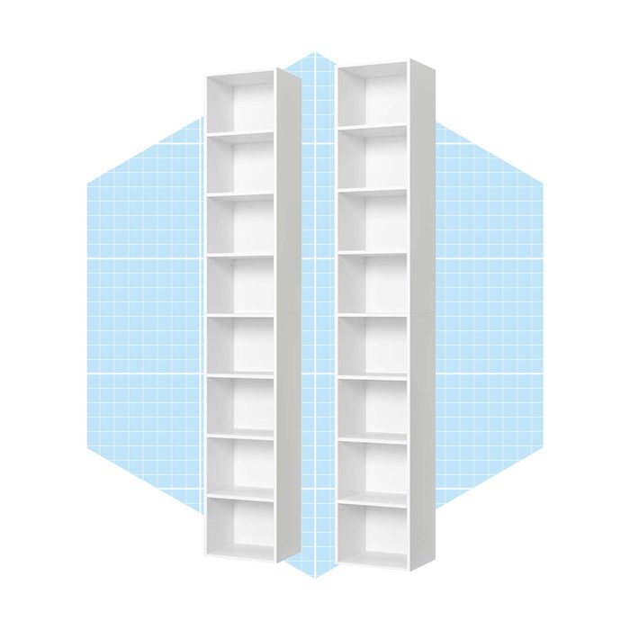 Two tall, white bookshelves stand upright, evenly spaced apart, against a light blue, grid-patterned background, showcasing their empty shelves.