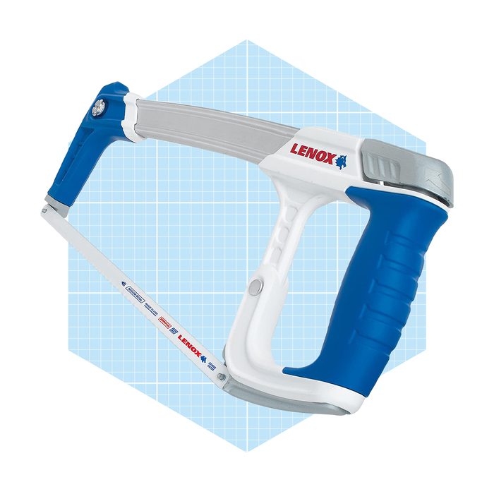 A handsaw with a blue and white handle is positioned diagonally against a light blue grid background, designed for cutting materials efficiently.