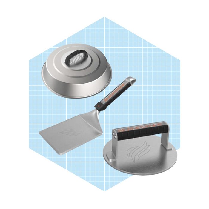 Three grilling tools are displayed: a lid, a spatula, and a press, all against a light blue grid background, emphasizing their functional design.