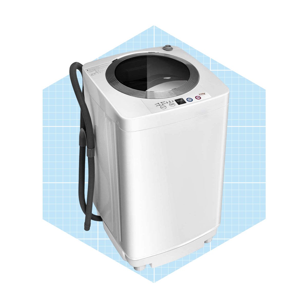 A compact, white washing machine sits with controls on top, connected by a hose, against a light blue grid background.