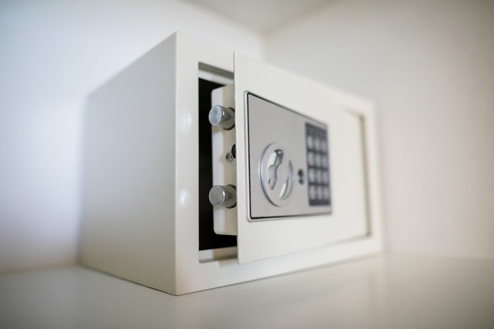 white Metal safe in a home. safe door is ajar