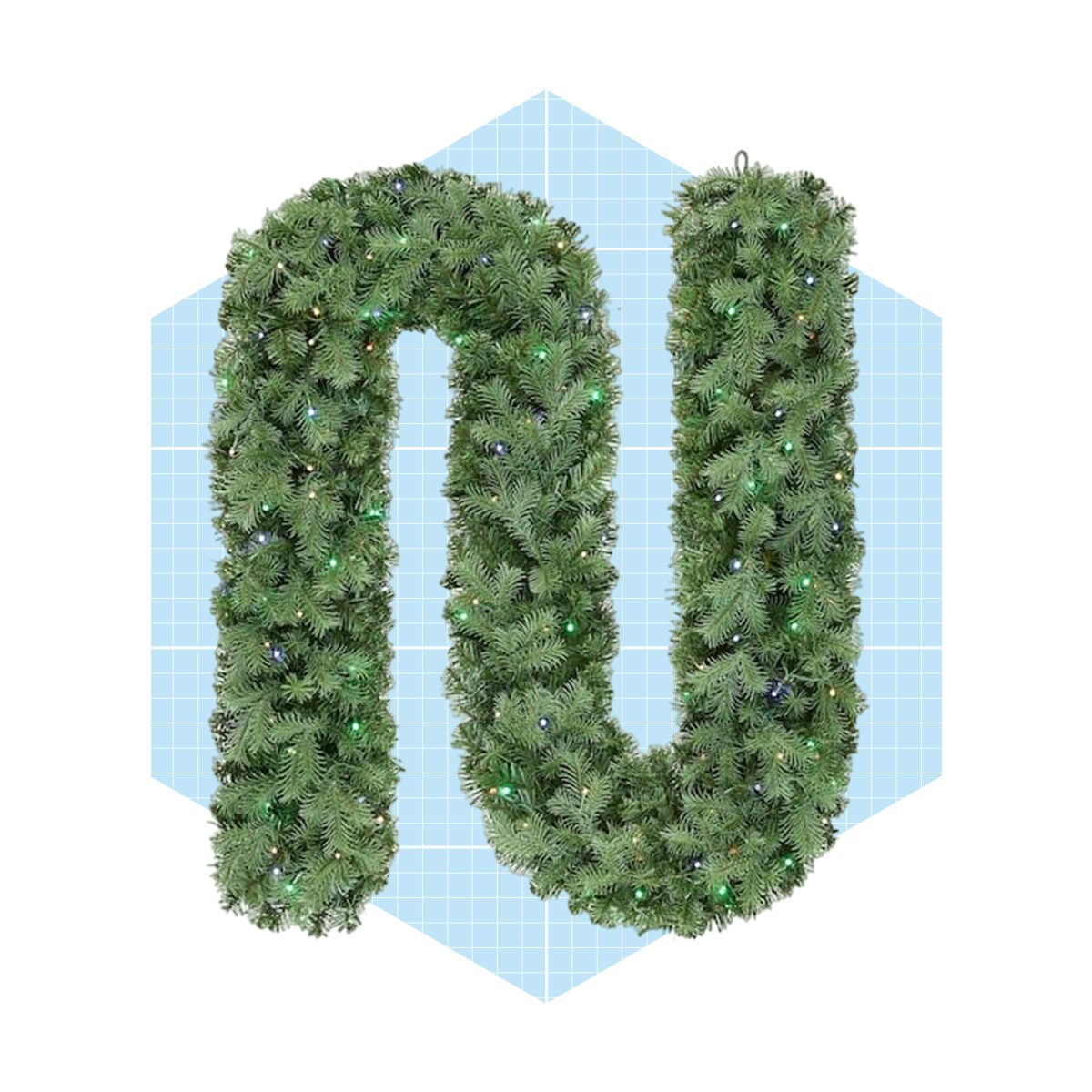 A large, green holiday garland shaped like the letter "U" is displayed against a light blue grid background, adorned with colorful lights.