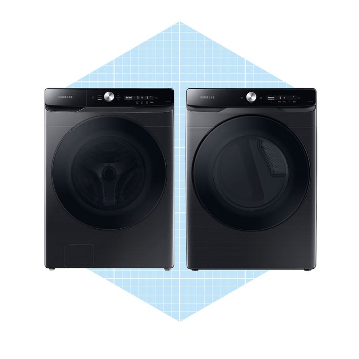 Two black appliances, a washing machine and a dryer, stand side by side against a light blue grid background, showcasing their modern design and sleek controls.