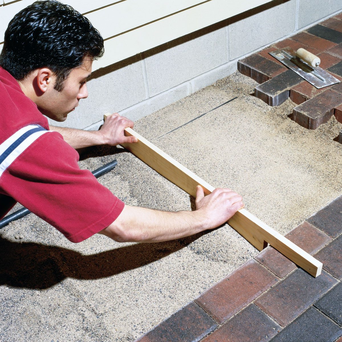 Screeding the sand