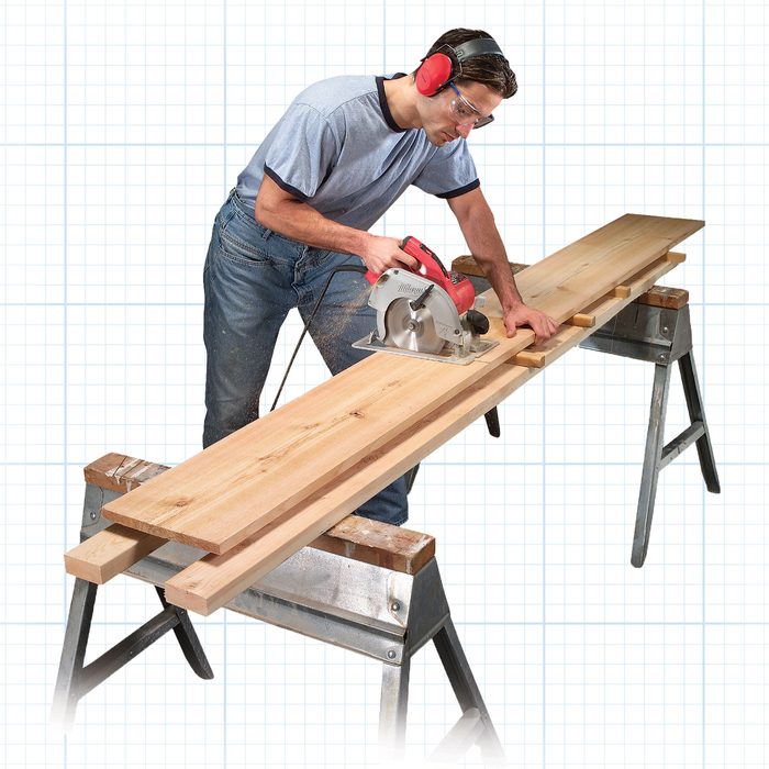Man cutting a piece of wood