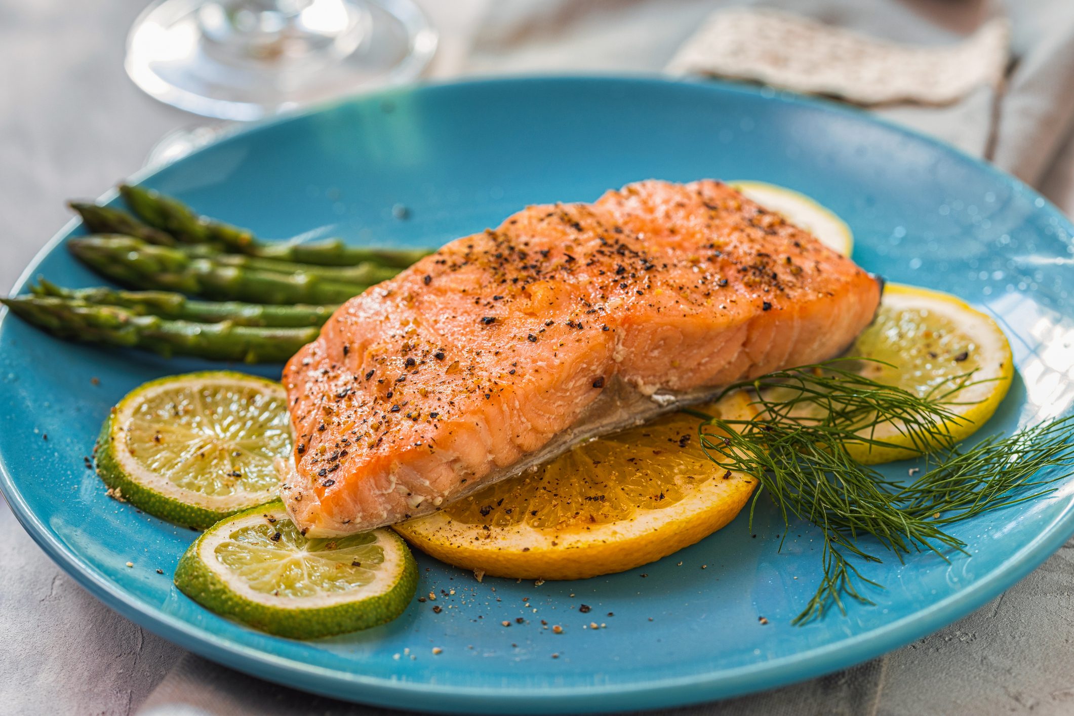 Fillet of salmon with asparagus served on a plate