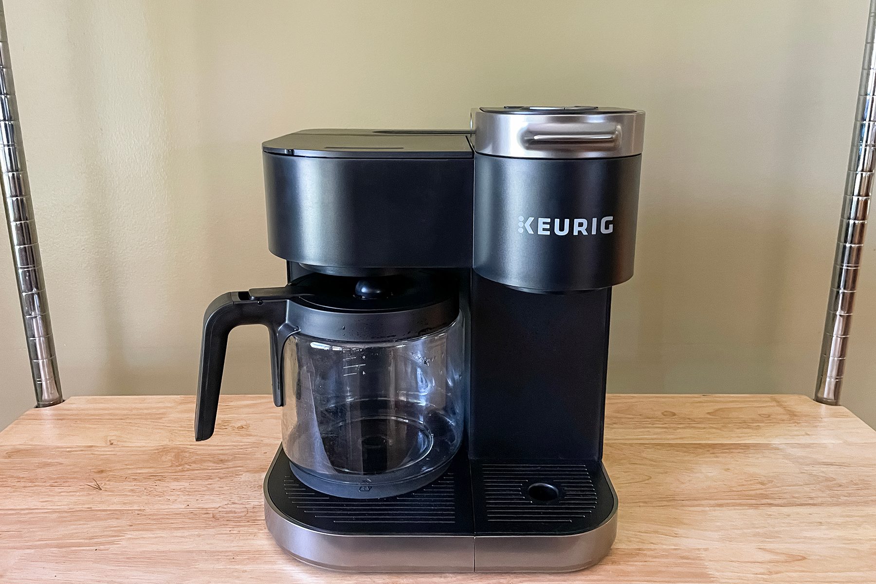 A Keurig K Duo Single Serve &amp; Carafe Coffee Maker On A Table Top.
