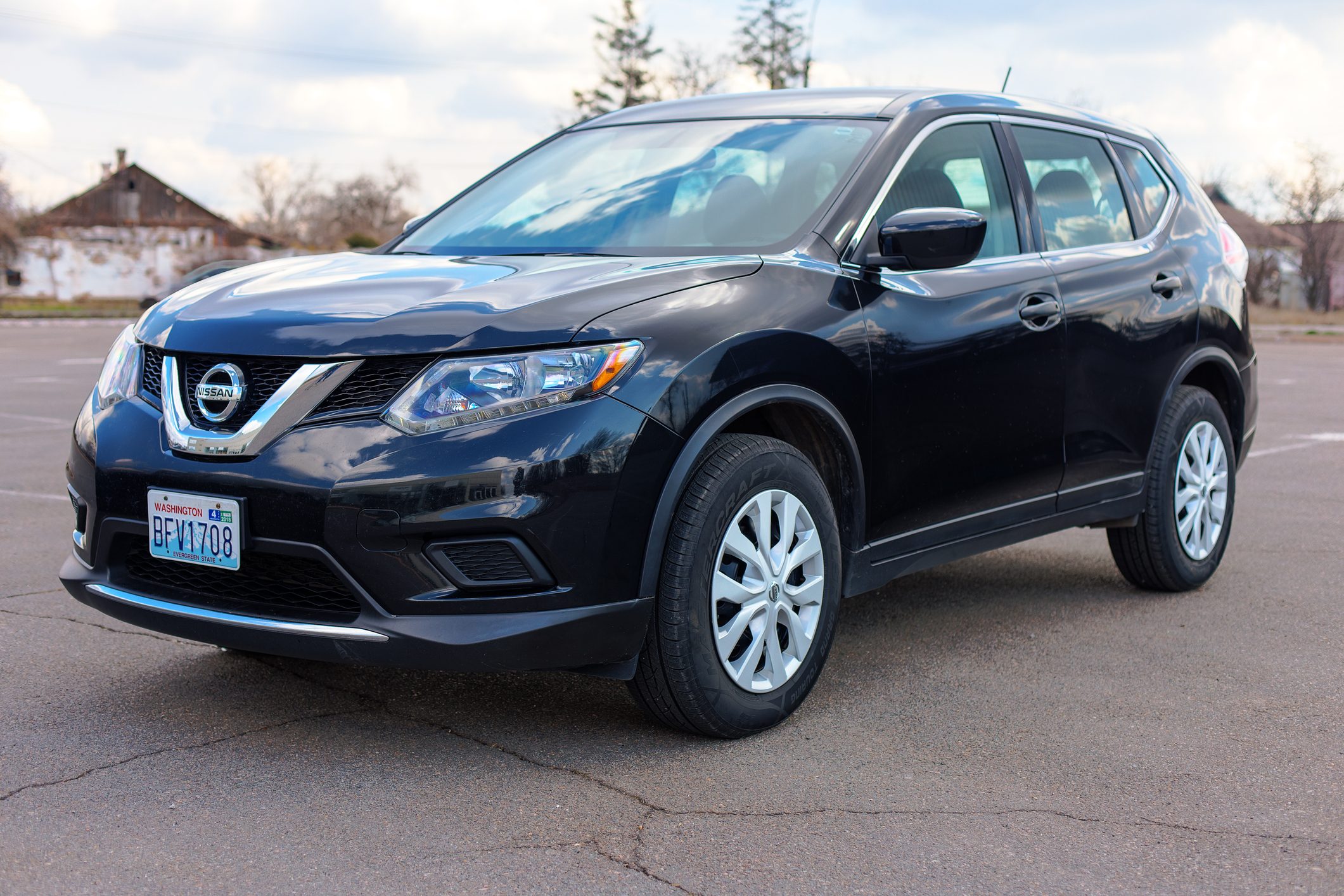 Black Nissan Rogue in the open air